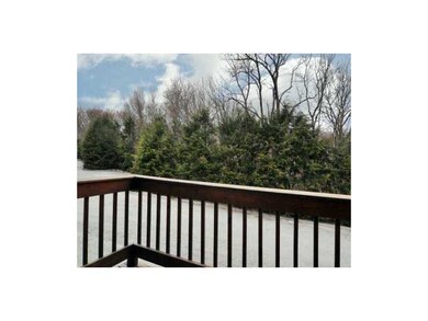 Exterior Front. Private wooded back deck is access
