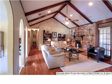 Wood floors throughout the family room and down th
