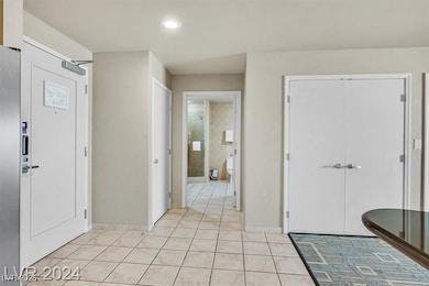 Foyer entrance featuring recessed lighting, light