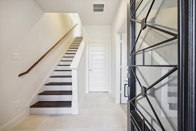 This stylish entryway sets the tone for this 3-bed