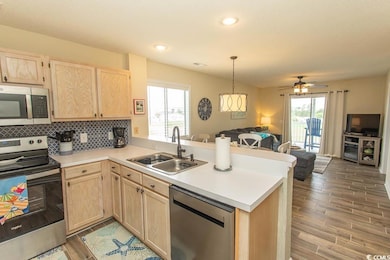 Kitchen featuring stainless steel appliances, a pe
