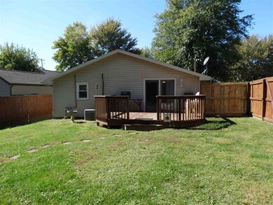 Enjoy the back deck and spacious yard.