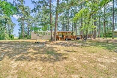 View of yard featuring a wooden deck