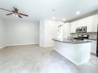 Kitchen featuring stainless steel appliances, bac