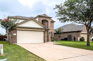 Traditional-style home with brick siding, concret