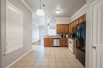 Kitchen featuring appliances with stainless steel