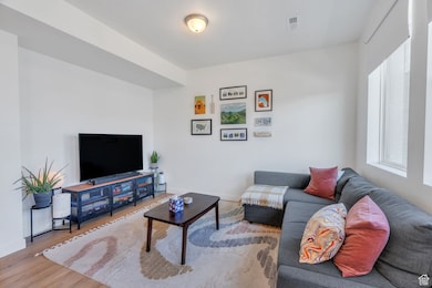 Living room with wood finished floors and baseboards