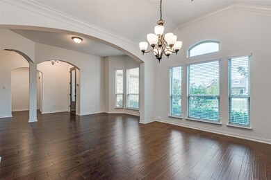 View of dining room, sitting area, and entry foyer