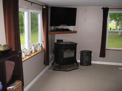 Large living room with pellet stove.