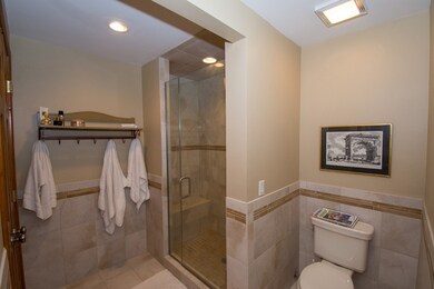 Large tiled shower, hard surface countertops all r