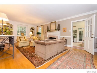 Living Room view of fireplace & entry to Florida R