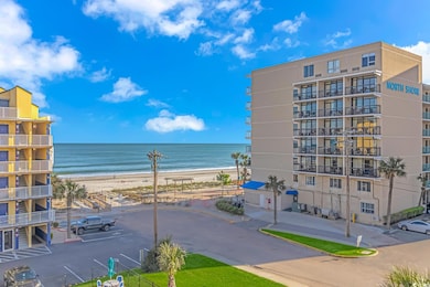 Property view of water with a beach view