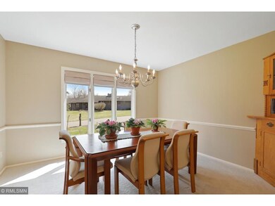 A separate formal dining room is flooded with sout