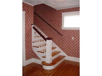 Entry. FRONT FOYER WITH STAIRS VIEW