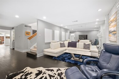 Gorgeous living room has mirror for depth, large w