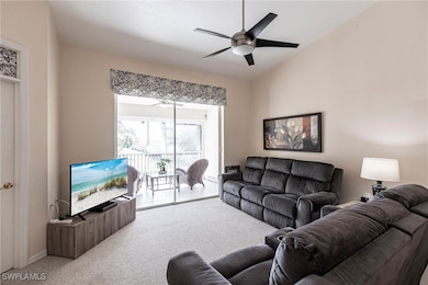 Living room with lofted ceiling, carpet, and ceili