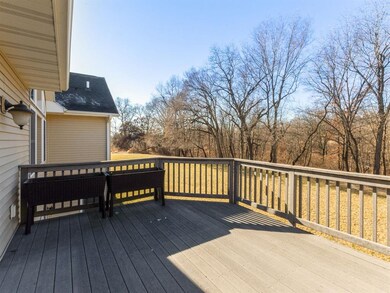 Rear deck overlooking back yard and woodlands