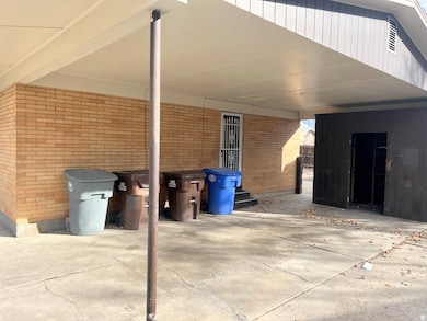 View of patio / terrace with a carport