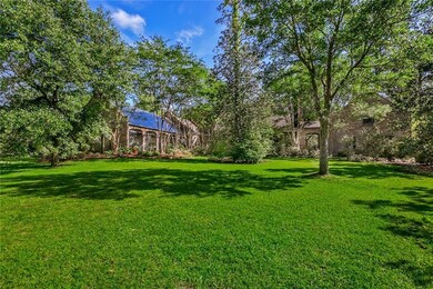Rear view....stately brick pool house to left.