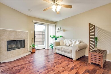 Living room features neutral colors plus wood burn