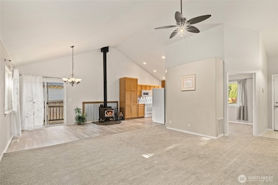 Door on the right is a bedroom. Entry to home is next to it with shoe storage cabinet and coat rack.
