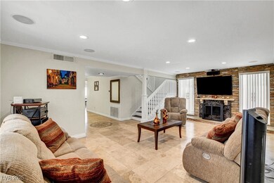 Living room featuring stairs, baseboards, ornament