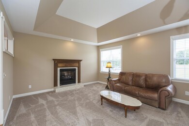 Formal sitting room with dual fireplace 