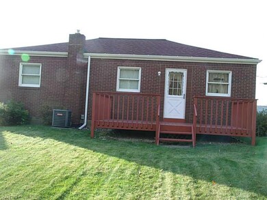 Exterior Back. Deck off of kitchen area and level 