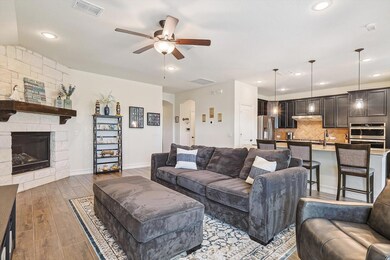 Living room with light hardwood / wood-style floor