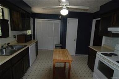 Kitchen area with the bifold doors to the laundry 