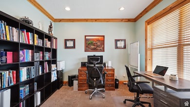Office area featuring baseboards, carpet, recessed lighting, and crown molding