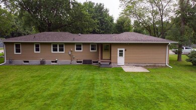 Back view with doors to kitchen and garage