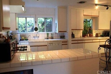 The centrally located kitchen has lots of counter 