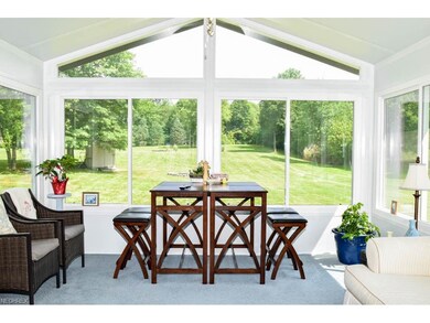 Enjoy backyard views from the sun room with vaulte