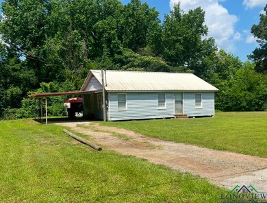 View of front of property with a front yard and a 