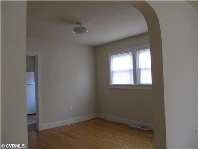 Dining Room - Wood floors, arched doorway.