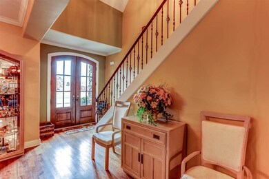 Hardwoods in entry that continue throughout the ha