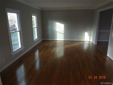 Large living room with wood flooring