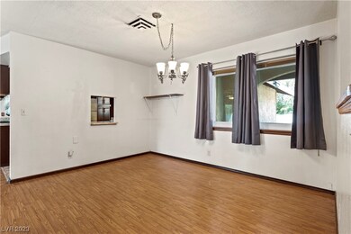 Formal dining room has pass-through to the kitchen
