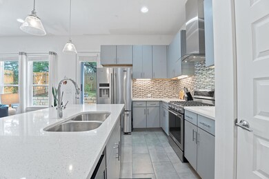 Kitchen featuring stainless steel appliances, gra