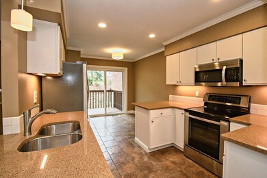 Kitchen features new counters and appliances.