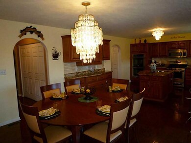 Kitchen. The eat in area is adjacent to the upper 