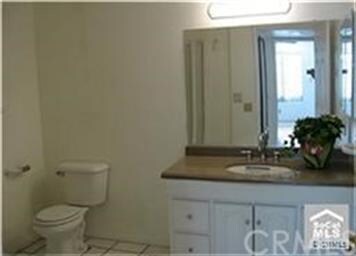 Bathroom includes granite counter top and sparklin