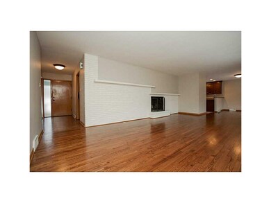 Living Room. Wood-burning fireplace to cozy up thi