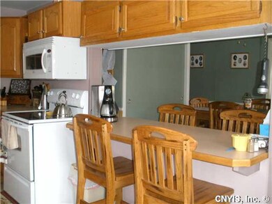 Kitchen Breakfast bar overlooks dining room