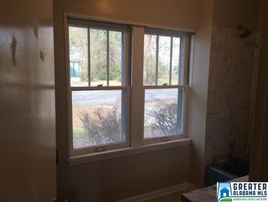 Large beautiful windows in master bath bringing na