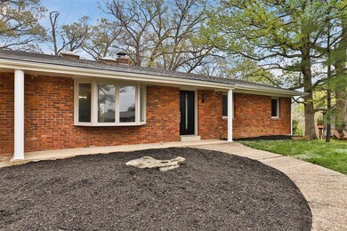 Brick veneer front, covered patio, and bay window 