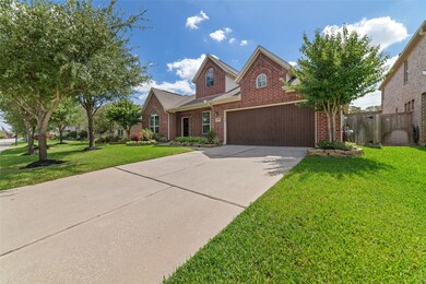 Beautiful Oaks and Crape Myrtles shade the lush landscaping, offering wonderful curb appeal.