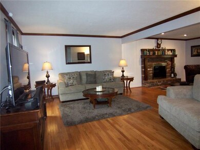 Living room has an open floor plan to family room.
