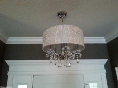 Chandelier in foyer.